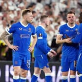 Rangers' Aaron Ramsey stands dejected with Calvin Bassey following the penalty shoot out during the UEFA Europa League Final at the Estadio Ramon Sanchez-Pizjuan, Seville. Picture date: Wednesday May 18, 2022.