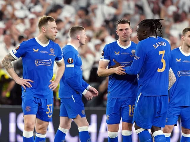 Rangers' Aaron Ramsey stands dejected with Calvin Bassey following the penalty shoot out during the UEFA Europa League Final at the Estadio Ramon Sanchez-Pizjuan, Seville. Picture date: Wednesday May 18, 2022.