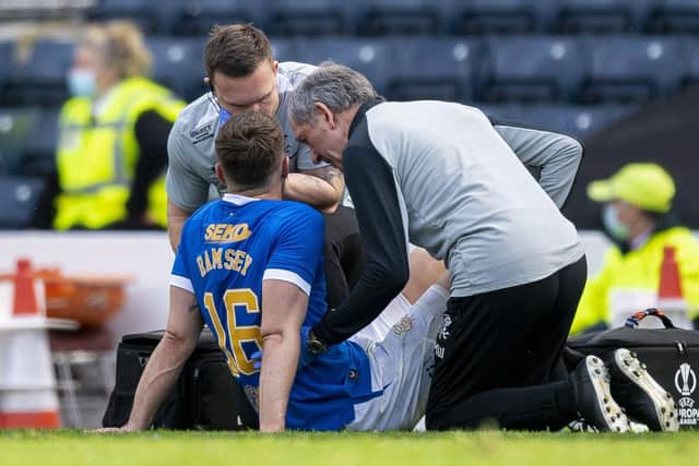 Rangers' Aaron Ramsey goes down with an injury during a Scottish Cup Semi-Final between Celtic and Rangers at Hampden Park, on April 17, 2022, in Glasgow, Scotland. (Photo by Ross MacDonald / SNS Group)