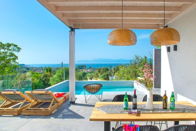 A new addition located in a rural-feeling spot amongst olive trees, yet with superb sea views from the pool and terraces and just a 15-minute walk (1.5km) to two coastal towns.
Well thought out, the open living and dining space is bright, fresh and welcoming with doors leading to pool/dining terrace that takes in the gorgeous sea views.
Each bedroom has its own contemporary-styled en-suite shower room with the option to have a double or twin configuration in one of the bedrooms.
This gives families, sharing couples or groups of mixed age the option to choose what suits them best.
In walking distance, the local coastal towns of Acharavi and Roda both have their own beach with plenty of bars, restaurants and shops – or a short drive further there’s a swathe of Blue Flag options.
The price for a one week stay starts from £2152 in August, while a week in May 2023 starts from £826. https://www.vintagetravel.co.uk/villas/villas-in-greece1/filio/