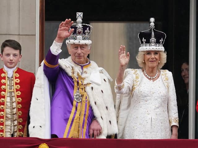 King Charles III and Queen Camilla on the balcony of Buckingham Palace following the coronation on May 6.  