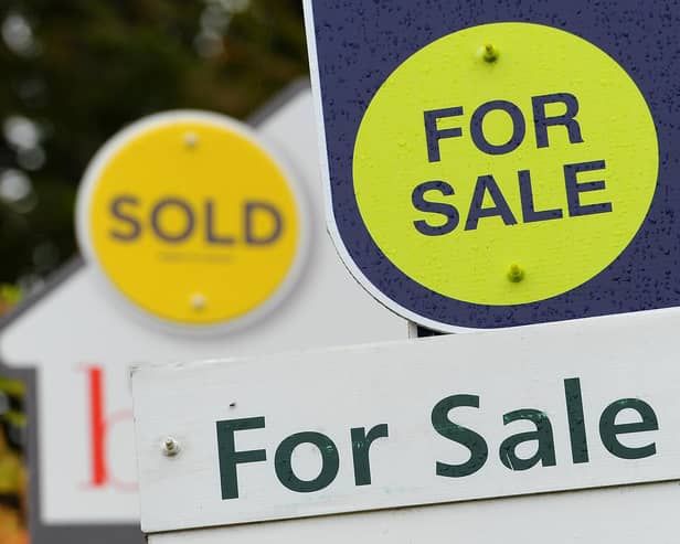 General view of estate agents signs outside a block of flats in Basingstoke, Hampshire.