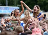 Festival goers watch Ella Henderson perform.