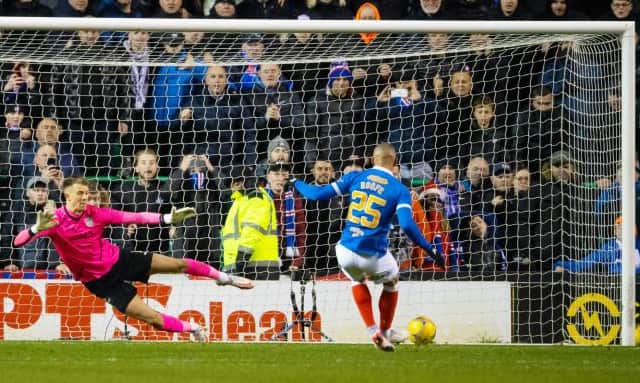 Rangers striker Kemar Roofe sends Hibs goalkeeper Matt Macey the wrong way from the penalty spot for the only goal of the game at Easter Road. (Photo by Craig Foy / SNS Group)