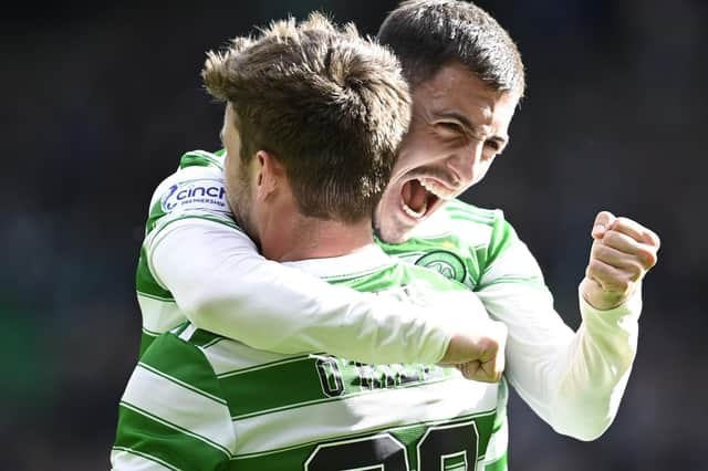 Substitute Matt O'Riley (L) celebrates making it 6-0 with Josip Juranovic. (Photo by Rob Casey / SNS Group)