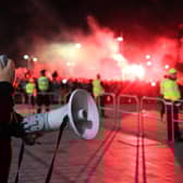 Ange Posetcoglou addresses celebrating Celtic fans with a megaphone outside Celtic Park. (Photo by Ewan Bootman / SNS Group)