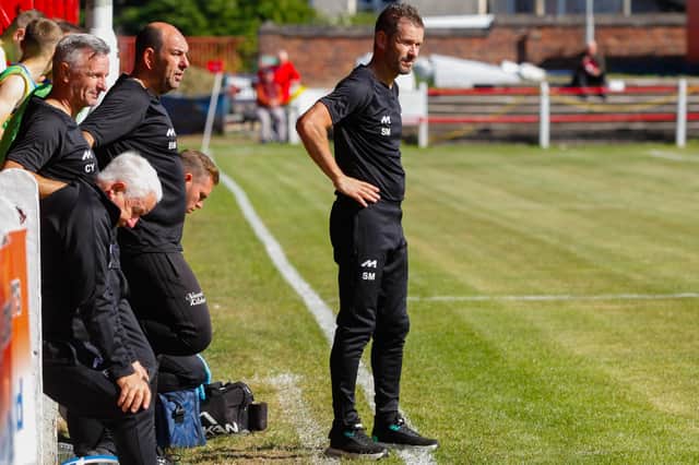 Rob Roy manager Stewart Maxwell focuses on the onfield action during Saturday's cup tie at Camelon (pic: Scott Louden)