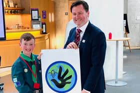 Christopher Stewart unveils the new badge with Bruce Adamson, Children and Young People’s Commissioner