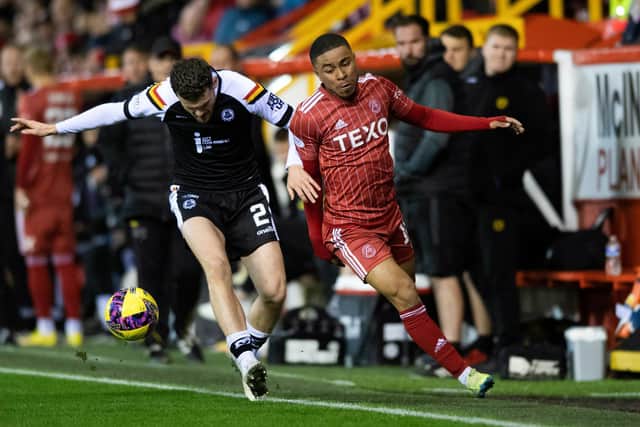 Aberdeen's Vicente Besuijen (right) is challenged by Partick's Jack McMillan in the Premier Sports Cup quarter-final clash at Pittdorie. (Photo by Mark Scates / SNS Group)