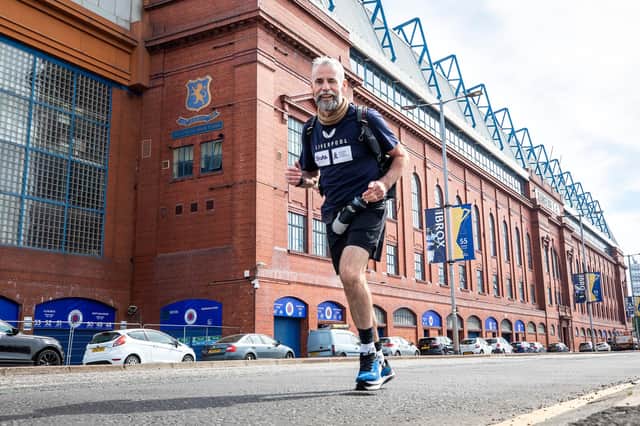 David Smith sets off from Ibrox Stadium to start his 21-day challenge