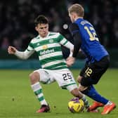 Celtic's Alexandro Bernabei comes in late on Hearts wing-back Nathaniel Atkinson. Picture: Craig Williamson / SNS