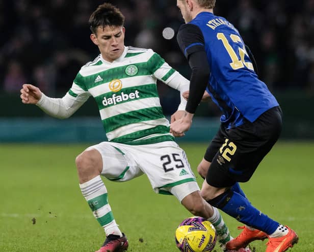 Celtic's Alexandro Bernabei comes in late on Hearts wing-back Nathaniel Atkinson. Picture: Craig Williamson / SNS