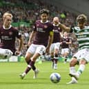 Celtic winger Jota takes on Hearts defender Nathaniel Atkinson at Celtic Park.