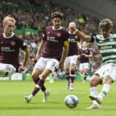 Celtic winger Jota takes on Hearts defender Nathaniel Atkinson at Celtic Park.