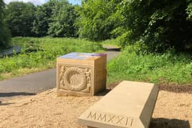 STUNNING: The installation on the canal towpath comprises of a stone bench, replica carvings, stone cairns, and interpretation panels