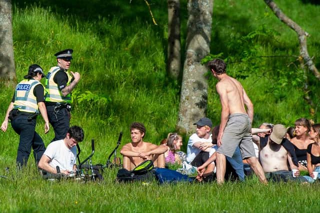 Police approach a group in Glasgow's Kelvingrove Park - if caught drinking outside you could be hit with a fine or a warning. Picture: SNS Group.