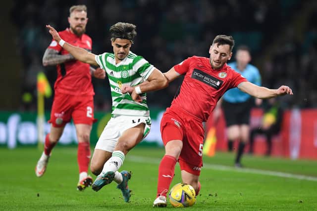 Celtic's Jota and St Mirren's Connor McCarthy battle for possession.  (Photo by Ross MacDonald / SNS Group)