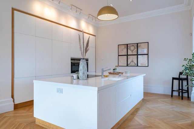 The kitchen has integrated Siemens appliances and Corian worktops.