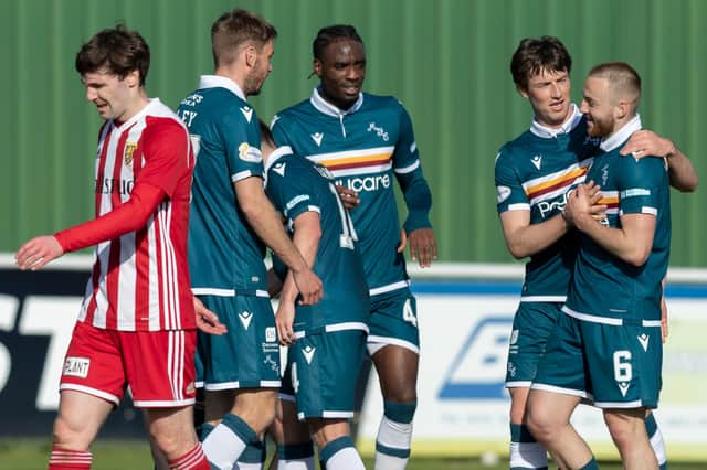 Motherwell's Allan Campbell celebrates his goal with team-mates during their Scottish Cup third-round game against Formartine United in Pitmedden today (Photo by Dave Cowe)