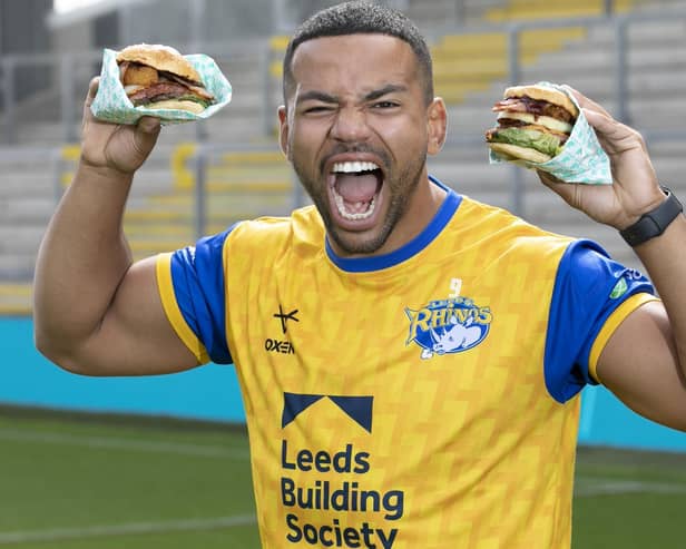 First men’s team captain of the Leeds Rhinos, Kruise Leeming, ‘try-s and tastes’ new Deliveroo x Hooyah Burgers exclusive Leeds Rhinos burger ahead of its launch on National Burger Day, August. 25 (photo: Doug Jackson/PinPep)