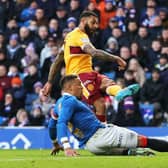 Kaiyne Woolery scores Motherwell's second goal in the 2-2 draw at Ibrox despite the efforts of Rangers captain James Tavernier. (Photo by Craig Williamson / SNS Group)