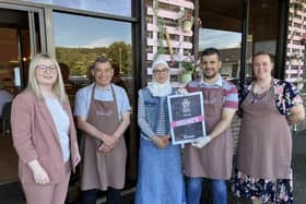 East Dunbartonshire MP Amy Callaghan with staff at Helmi's, Bearsden