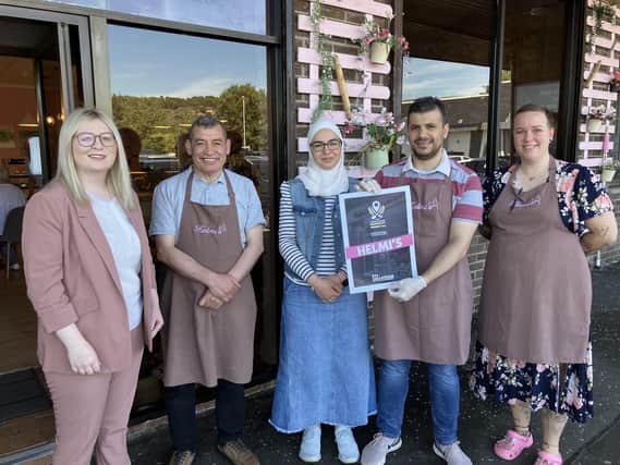 East Dunbartonshire MP Amy Callaghan with staff at Helmi's, Bearsden