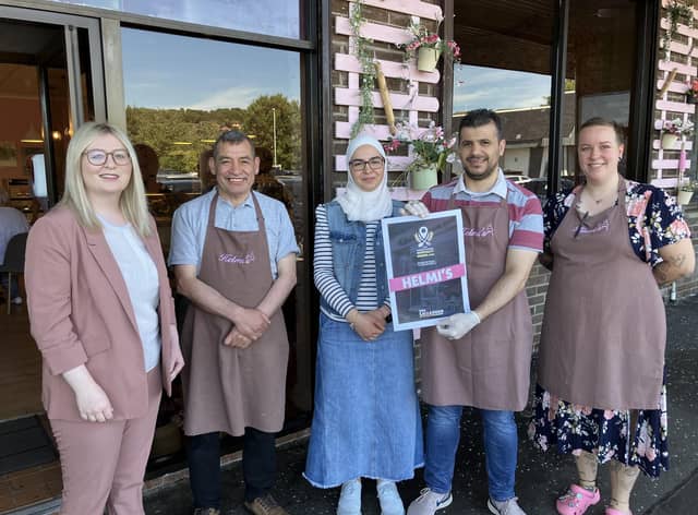 East Dunbartonshire MP Amy Callaghan with staff at Helmi's, Bearsden
