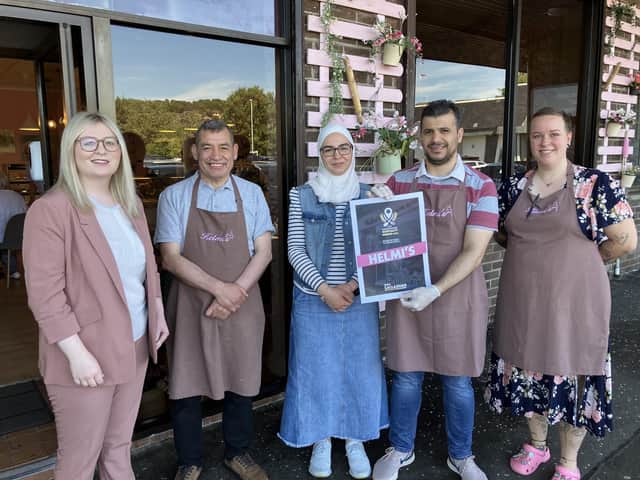 East Dunbartonshire MP Amy Callaghan with staff at Helmi's, Bearsden