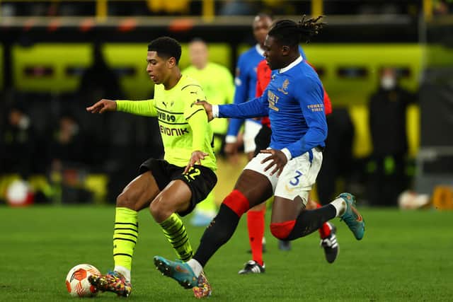 Rangers defender Calvin Bassey (right) challenges Jude Bellingham of Borussia Dortmund during the Europa League knockout round play-off match in Germany on Thursday. (Photo by Martin Rose/Getty Images)