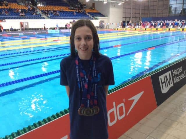 Evi Mackie with impressive medal haul