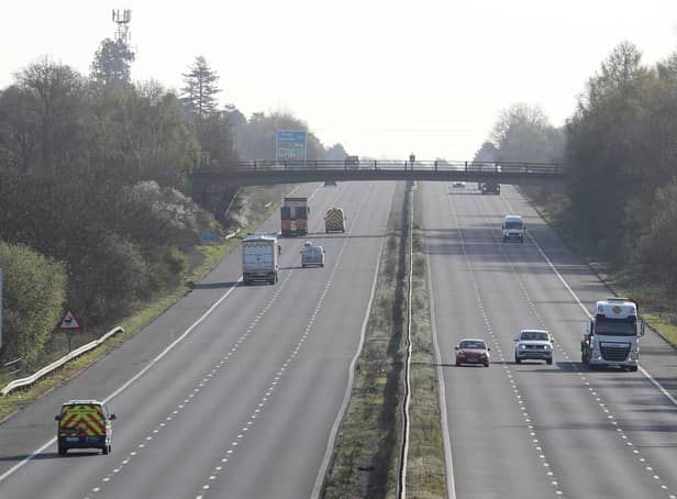 Cars make their way along the M3 motorway near to Fleet in Hampshire, as the UK continues in lockdown to help curb the spread of the coronavirus.