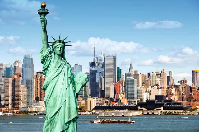 The New York city skyline cityscape with Statue of Liberty over the Hudson River could be your view in 2023.