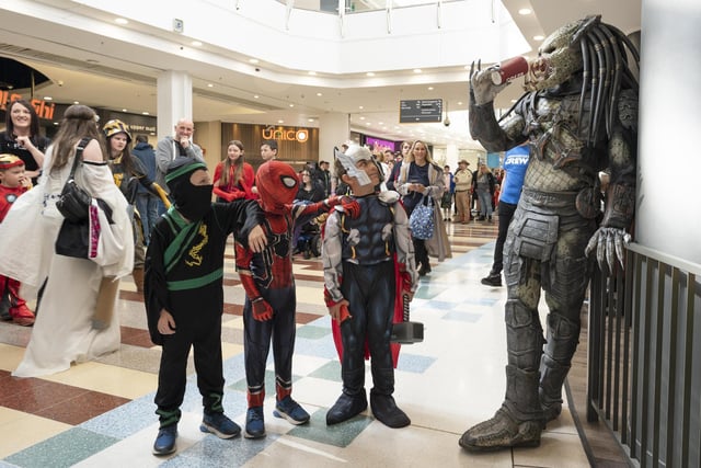 From left, five year old twins James and Lewis Ashwood with Oakley Drewett, aged nine with Predator.