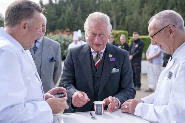 Prince Charles was keen to try New Lanark's very own ice cream. (Pics: Jane Barlow/Pool/AFP)