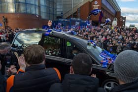 Fans gathered as the funeral car passed by Ibrox.