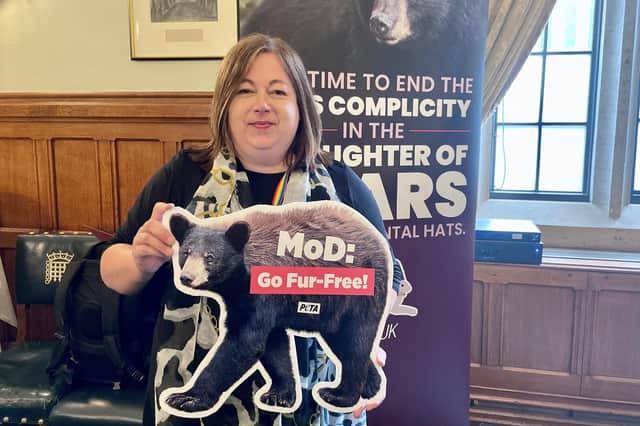 Kirsten Oswald with a PETA ‘MOD Go fur free’ poster
