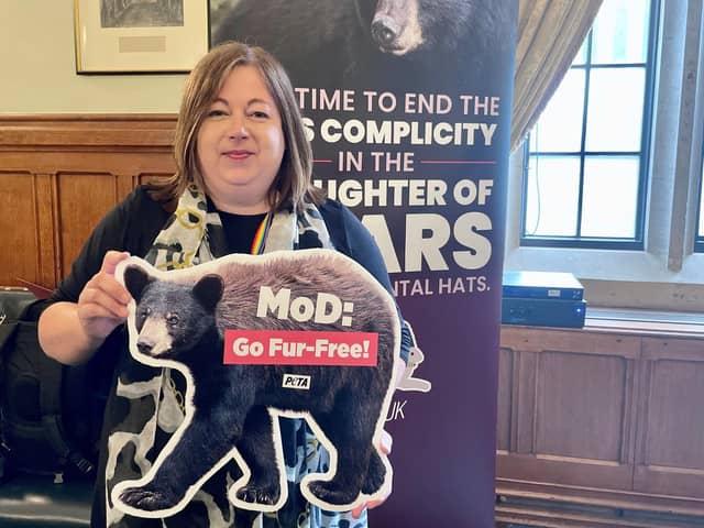 Kirsten Oswald with a PETA ‘MOD Go fur free’ poster