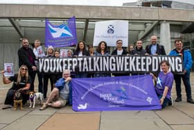 The group Faces And Voices of Recovery hold a protest outside the Scottish Parliament as Scotland's drugs death figures were published on July 28, 2022. Photo by Lisa Ferguson.