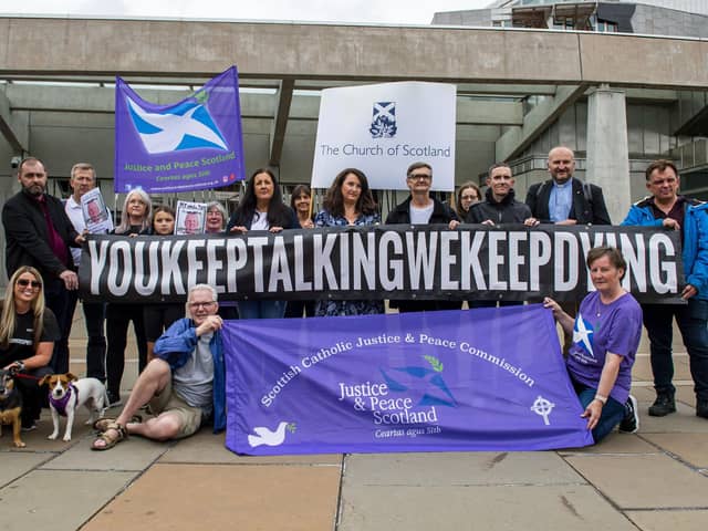 The group Faces And Voices of Recovery hold a protest outside the Scottish Parliament as Scotland's drugs death figures were published on July 28, 2022. Photo by Lisa Ferguson.