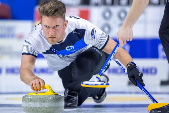 Ross Paterson in action at the LGT World Men's Curling Championship 2022 (pic: WCF / Steve Seixeiro)