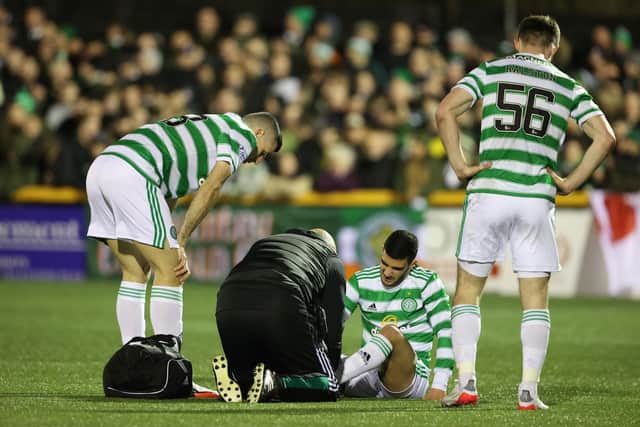 Celtic's Liel Abada goes down injured.