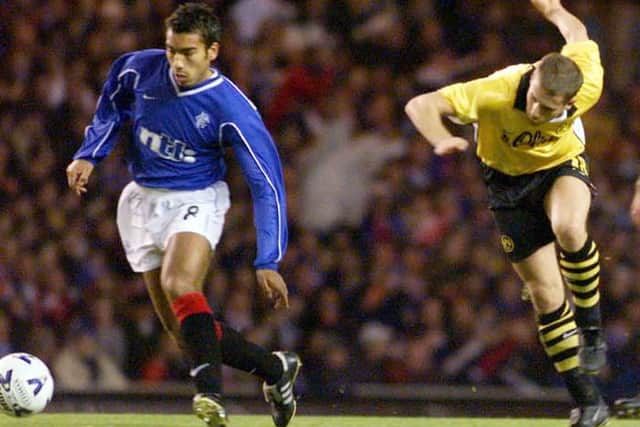 Giovanni van Bronckhorst in action for Rangers against Borussia Dortmund when the clubs last met in European competition in the third round of the UEFA Cup in the 1999-2000 season. (Photo by SNS Group).