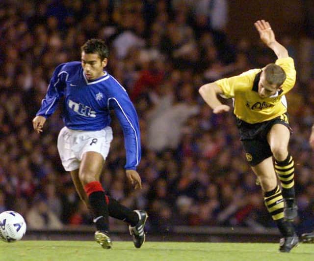 Giovanni van Bronckhorst in action for Rangers against Borussia Dortmund when the clubs last met in European competition in the third round of the UEFA Cup in the 1999-2000 season. (Photo by SNS Group).