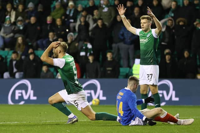 Ryan Porteous and Chris Cadden can't believe it as referee John Beaton points to the spot late in the game