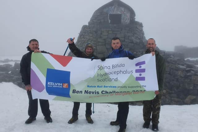 Colin Paterson, Chris Diplacito, John Kane and Jamie Kane celebrate reaching Scotland’s highest peak
