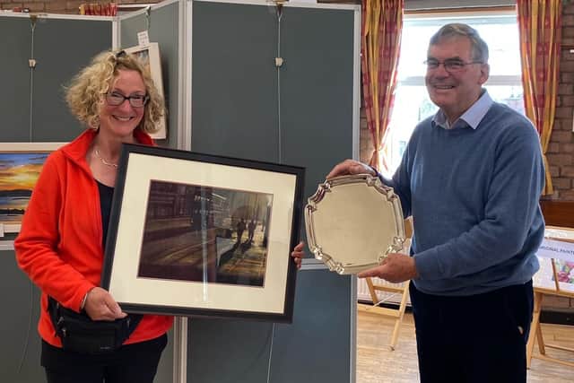 Aileen Semple receiving her award from club secretary Tom Gilchrist