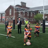 A brand new 3G rugby pitch at Lenzie Academy - the first of its kind in East Dunbartonshire - is being hailed as a game changer by pupils.
Pupils (l-r): Drew, Helena, Juliet & Kiendi
Others: (l-r): Joint Council Leader Andrew Polson, Head teacher Brian Paterson, Joint Council Leader Vaughan Moody, Joe Canavan (Allsports) and Jim Graham (Council Assets Team)