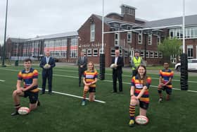 A brand new 3G rugby pitch at Lenzie Academy - the first of its kind in East Dunbartonshire - is being hailed as a game changer by pupils.
Pupils (l-r): Drew, Helena, Juliet & Kiendi
Others: (l-r): Joint Council Leader Andrew Polson, Head teacher Brian Paterson, Joint Council Leader Vaughan Moody, Joe Canavan (Allsports) and Jim Graham (Council Assets Team)