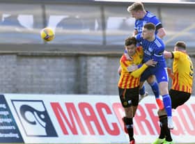 Peterhead's Jason Brown comes close with a header against Partick Thistle (pic: Duncan Brown)